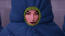 a cartoon character is wrapped in a blue sleeping bag with a hood