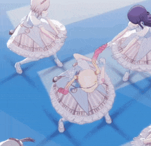 a group of anime girls are dancing on a blue background