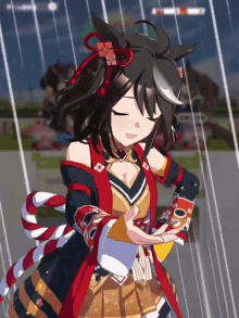 a girl with black hair and a red and gold outfit is dancing in the rain