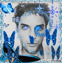 a black and white photo of a man with blue butterflies around his face and the caption picmix