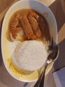 a plate of food from jollibee with rice and gravy