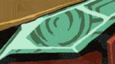 a close up of a green object with a pattern on it .