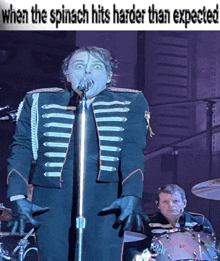 a man singing into a microphone with the words when the spinach hits harder than expected above him