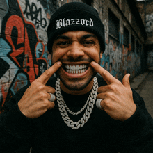 a man wearing a black beanie with blazzard on it