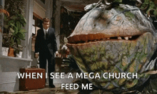a man in a suit and tie is standing in front of a monster plant that says when i see a mega church feed me