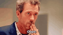 a man with a beard is making a funny face and saying oops .