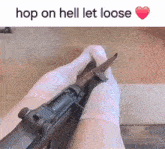a person holding a gun with the words hop on hell let loose in the corner