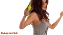 a woman wearing a grey tank top that says songs every man should know