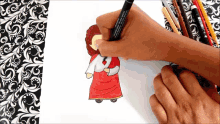 a person is drawing a cartoon of jesus with a marker that says ' sketch ' on it