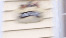 a blurred image of a shelf with a label that says ' i 'm sorry '