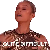 a woman in a gold dress is making a quite difficult face