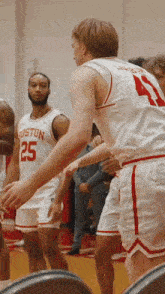 a group of boston basketball players standing on the court