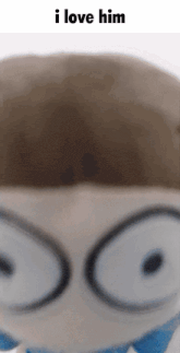 a close up of a stuffed animal with the words " i love him " above it