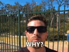 a man wearing sunglasses is asking the question " why "
