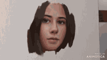a close up of a painting of a woman 's face made in animotica