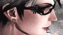 a close up of a woman 's face wearing glasses and gold earrings