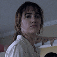 a close up of a woman 's face with a tear running down her face