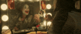 a man in a clown costume is looking at himself in the mirror