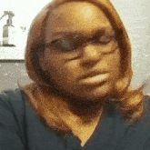 a close up of a woman wearing glasses and a black shirt