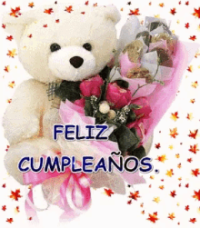 a teddy bear is holding a bouquet of pink flowers with the words feliz cumpleanos written below it