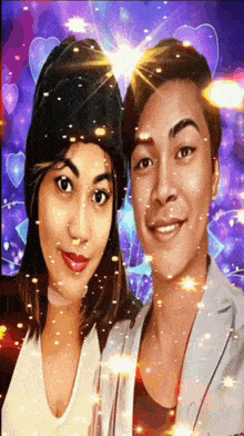 a man and a woman are posing for a picture with hearts behind them