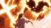 a man in a white shirt is standing in front of a fireball .