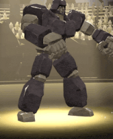 a robot is standing in front of a crowd of people in a stadium