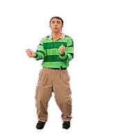a man in a green and brown striped shirt and khaki pants is dancing