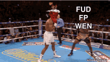 a man in a boxing ring with fud fp wen written above him