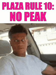 a man in a car with the words plaza rule 10 no peak