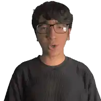 a man wearing glasses and a black shirt with the word juan on it