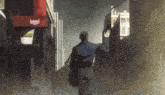 a man is walking down a street in front of a red sign that says bmgd