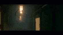 a person standing in a dark room with fire coming out of their mouth
