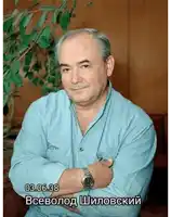 a man with his arms crossed has a watch on his wrist and the date 03 06.38