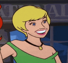 a cartoon woman with blonde hair and blue eyes is smiling and wearing a green top .