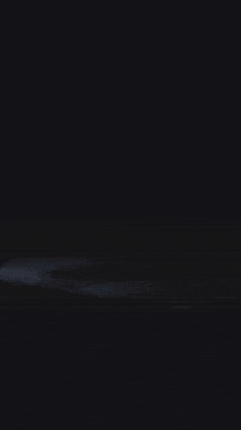 a glowing object in the dark that looks like a flame