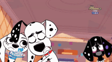 two dalmatian dogs standing next to each other with a disney logo on the bottom
