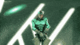 a man in a green outfit is standing in front of a green light .