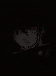 a close up of a person 's face with red eyes