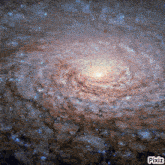 a picture of a spiral galaxy with pixiz written on the bottom right