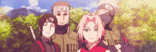 a group of anime characters are standing next to each other in a forest .