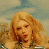 a woman with blonde hair is wearing chains around her arms