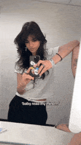 a woman taking a selfie in front of a mirror with the caption " baby read my mind ... "