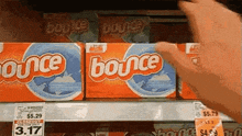 a person is reaching for a box of bounce