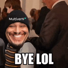 a man wearing a hat that says multivers is smiling and says bye lol