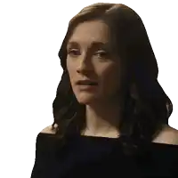 a close up of a woman 's face with a serious look on her face