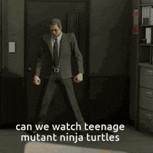 two men in suits are dancing in a dark room .
