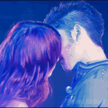 a man and a woman are kissing in front of a blue background that says mafia rbd on it