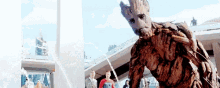 groot from guardians of the galaxy is standing in front of a fountain in a city .