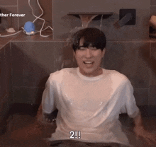 a man in a bathtub with the words " 2 !! " on the bottom